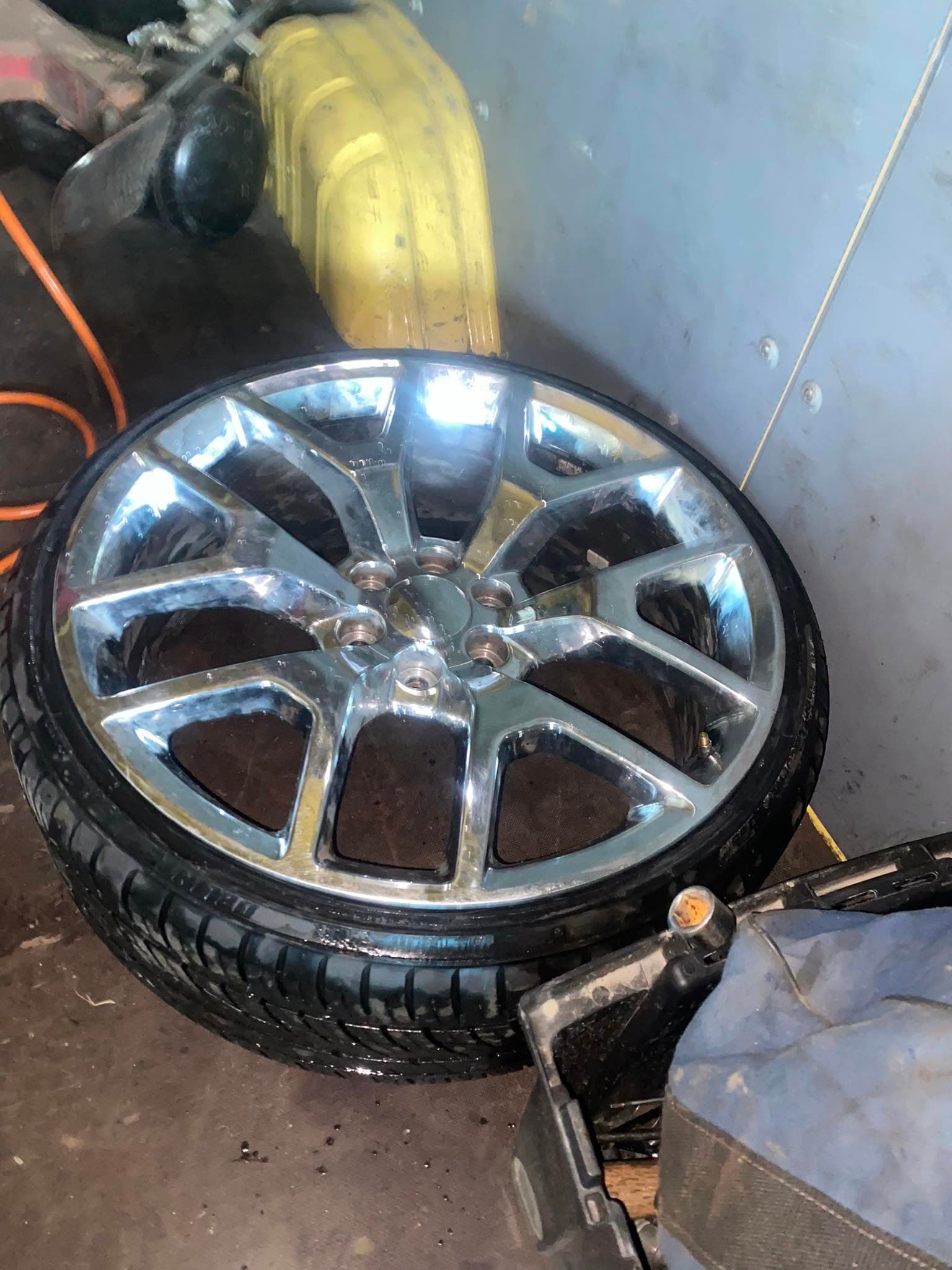 Wheel and tire removed for service at Tires 4 Less Roadside